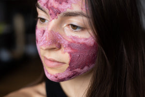 woman wearing pink hibiscus face mask